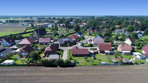 High angle view of houses and buildings against sky