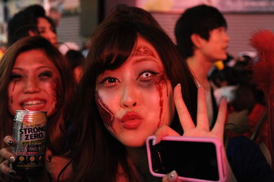 Portrait of young woman using smart phone