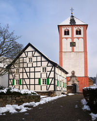 Building against sky during winter