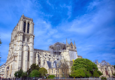 Low angle view of historical building against blue sky