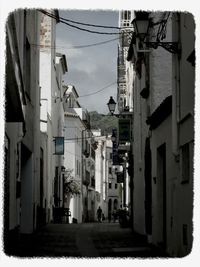 Buildings in city against sky