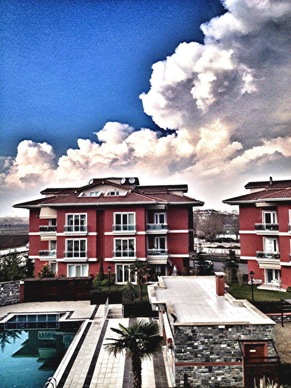 building exterior, architecture, built structure, sky, residential structure, house, residential building, cloud - sky, cloud, residential district, blue, roof, window, cloudy, city, day, outdoors, building, no people, balcony