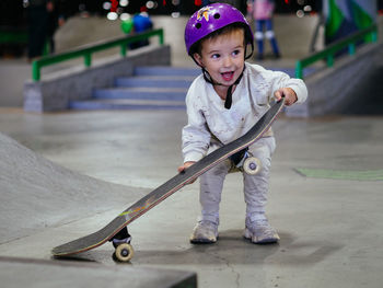 Portrait of boy standing on street