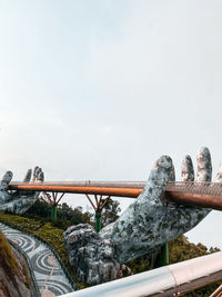 Low angle view of bridge against sky during winter