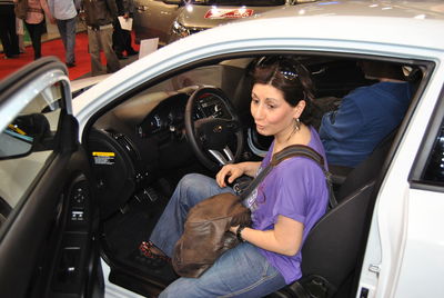 High angle view of woman sitting in car