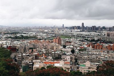 Aerial view of cityscape against sky