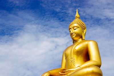 Low angle view of statue against sky