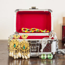 Close-up of jewelry in box on table