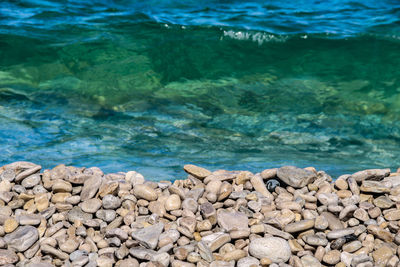 High angle view of rocks at sea shore