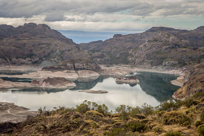 Scenic view of lake and mountains against sky