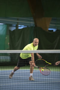 Man playing tennis