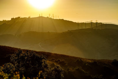 Scenic view of mountains against sky during sunset