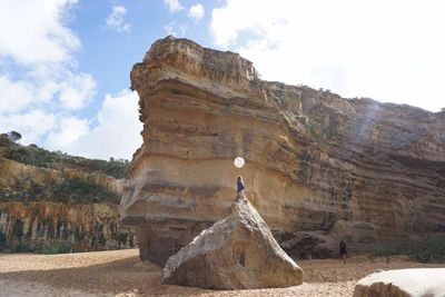 Rock formation on land against sky