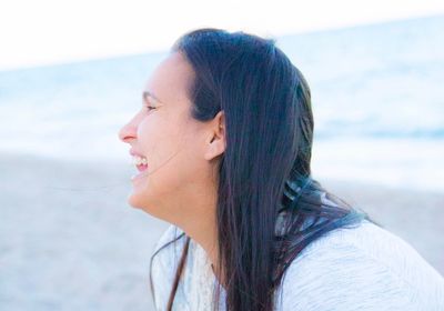 Smiling woman at beach