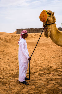 Woman standing in desert