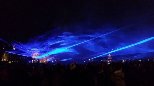 People enjoying music concert at night