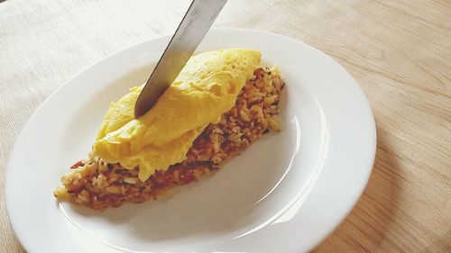 Close-up of knife on food in plate