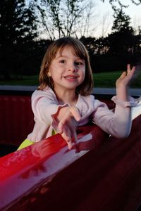 Portrait of girl sitting in pick-up truck