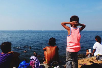 Children looking at sea