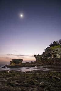 Scenic view of sea against sky at night