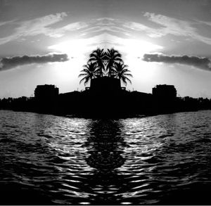 Scenic view of river at sunset