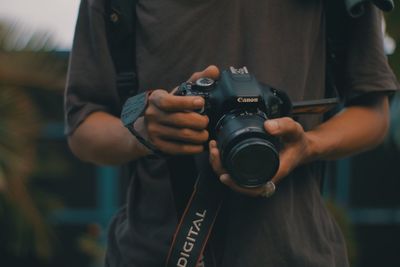 Midsection of man photographing