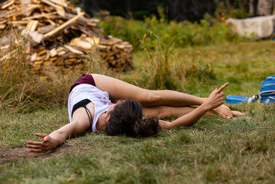 Woman lying on field