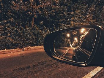 Reflection of car on side-view mirror