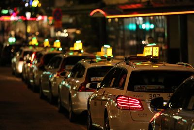 Cars on street at night