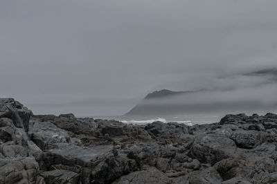 Scenic view of rocks against sky