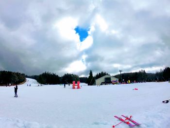 Scenic view of landscape against sky during winter