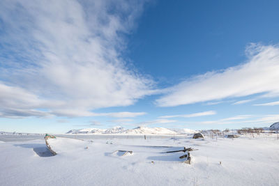 Scenic view of landscape against sky during winter