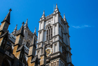 Low angle view of buildings against blue sky