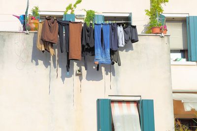Low angle view of clothes drying on wall