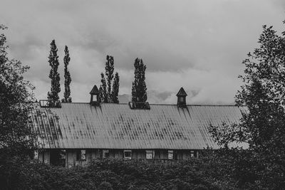 Low angle view of building against cloudy sky