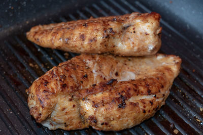 High angle view of meat on barbecue grill