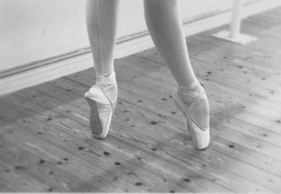 Woman walking on wooden floor