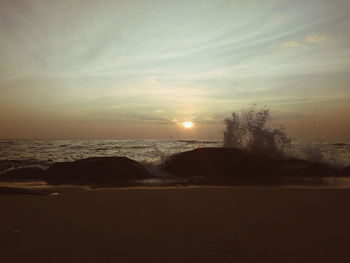 Scenic view of sea at sunset
