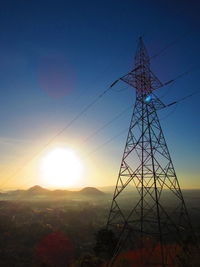 Electricity pylon at sunset