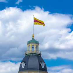 Low angle view of flag against building