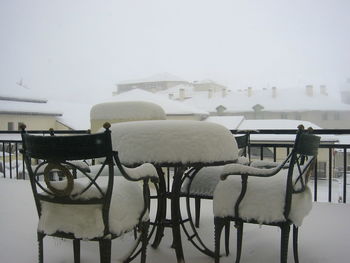 Snow covered chairs