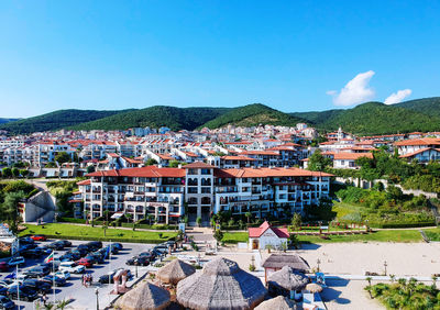 High angle view of townscape against blue sky