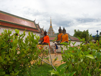 Statue of temple against cloudy sky