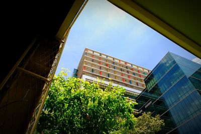 Low angle view of modern buildings against sky