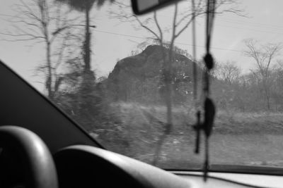 Close-up of wet car window in rainy season