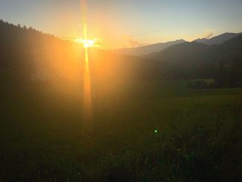 Scenic view of landscape against sky during sunset