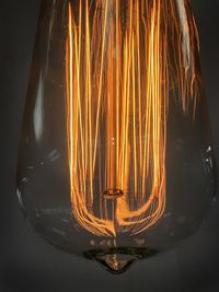 Close-up of illuminated light bulb