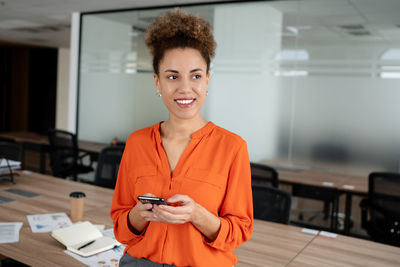 Young woman using mobile phone