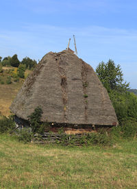 House on field against sky