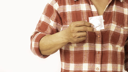 Close-up of man hand against white background